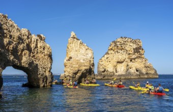 Tour with sea kayaks to the Ponta da Piedade rocky coast, rugged coastal landscape, right next to