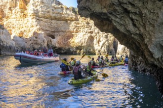 Tour with sea kayaks to the Ponta da Piedade rocky coast, rugged coastal landscape, right next to