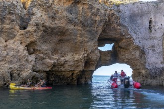 Tour with a small motorboat to the Ponta da Piedade rocky coast, rugged coastal landscape, right