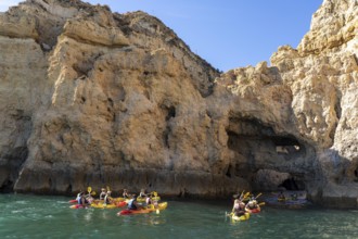 Tour with sea kayaks to the Ponta da Piedade rocky coast, rugged coastal landscape, right next to