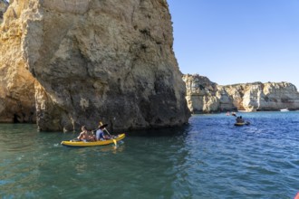 Tour with sea kayaks to the Ponta da Piedade rocky coast, rugged coastal landscape, right next to
