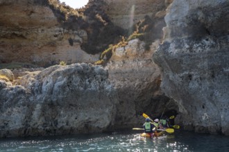Tour with sea kayaks to the Ponta da Piedade rocky coast, rugged coastal landscape, right next to