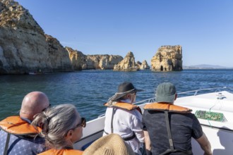 Tour with a small motorboat to the Ponta da Piedade rocky coast, rugged coastal landscape, right