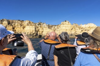 Tour with a small motorboat to the Ponta da Piedade rocky coast, rugged coastal landscape, right