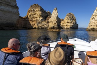 Tour with a small motorboat to the Ponta da Piedade rocky coast, rugged coastal landscape, right