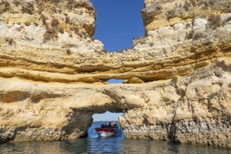 Tour with a small motorboat to the Ponta da Piedade rocky coast, rugged coastal landscape, right