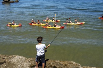 Kayak tours to the rocky coast of Ponta da Piedade, groups of tourists in kayaks on the sea to the