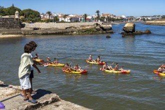 Kayak tours to the rocky coast of Ponta da Piedade, groups of tourists in kayaks on the sea to the