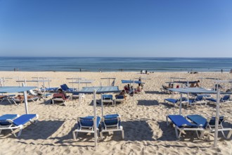 Kilometre-long sandy beach Praia do Barril, on the island off Santa Luzia, Algarve, Portugal