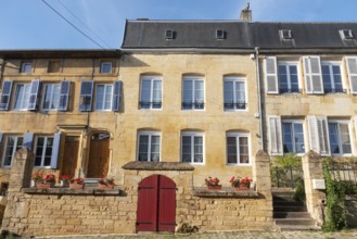 Renovated house facade, historic building, yellow sandstone, Marville, Renaissance village,