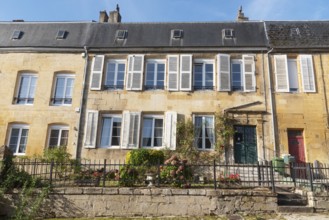 Renovated house facade, historic building, yellow sandstone, Marville, Renaissance village,