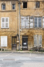 Historic house facade, abandoned building, yellow sandstone, Marville, Renaissance village,