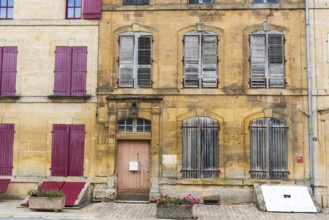 Historic house facade, abandoned building, yellow sandstone, Marville, Renaissance village,