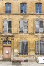Historic house facade, abandoned building, yellow sandstone, Marville, Renaissance village,