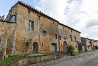 Abandoned street with historic house facades, yellow sandstone, Marville, Renaissance village,