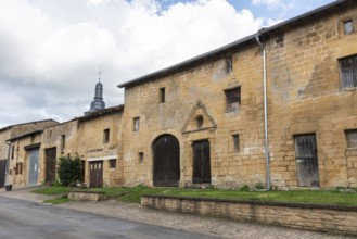 Abandoned street with historic house facades, yellow sandstone, Marville, Renaissance village,