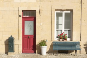 Entrance decorated with flowers, bench, Marville, Renaissance village, Département Meuse, Grand