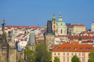 Famous Charles Bridge on Vltava River and beautiful buildings of the old town of Prague, Czech