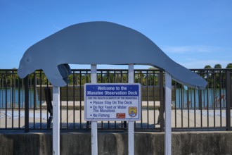 Manatee observation deck with sign under a clear sky, Haulover Canal, Merritt Island National