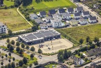 Aerial view, Aldi supermarket with solar roof and new housing estate Büscherstrasse in Bergkamen,