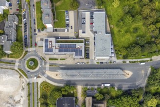 Aerial view, bus station with roundabout and savings bank building with solar roof in Schönhausen,