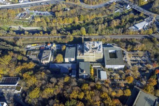 Aerial view, construction site and new building at the Berufskolleg Berliner Platz in the district