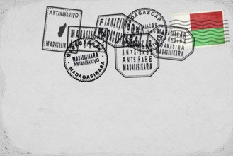 Madagascar Vintage Postcard with Flag Stamp and City Postmarks