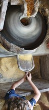 Water mill for grinding corn, Mill Stone, Making corn flour, Minas Gerais, Brazil