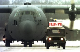 HUN, Karposvar, 01.12.1995 -- An American military aircraft is guided by a Hungarian military jeep