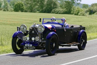 A blue classic car on a country road on a sunny day, classic car, car race, Mille Miglia, 1000