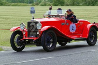 Red vintage car with a smiling woman on a rural road, vintage car, car race, Mille Miglia, 1000