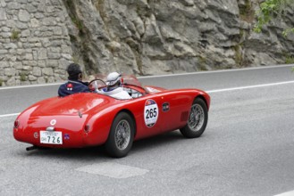 No. 265, O.S.C.A. MTA 1500 2AD, year of construction 1953, red vintage car driving on a road with