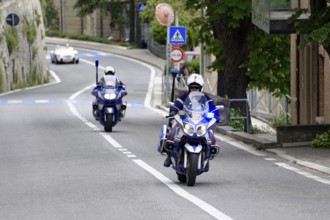 Police motorbikes driving on a road, accompanied by traffic signs, Mille Miglia 2014 or 1000