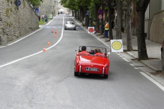 No. 279, Mercedes-Benz 300 SL W 198, model year 1954, red vintage convertible driving on a road