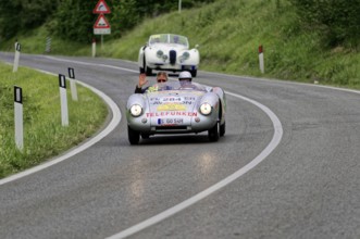 Classic car with two people on a winding country road, classic car, car race, Mille Miglia, 1000