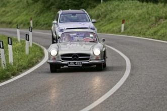 Silver Mercedes classic car on a country road with an SUV in the background, classic car, car race,