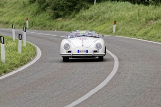 White Porsche convertible classic car on a winding road, classic car, car race, Mille Miglia, 1000