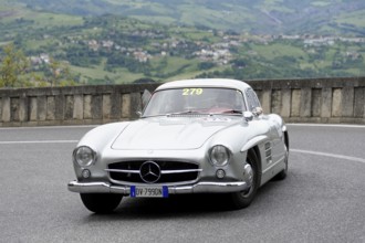 No.279, Mercedes-Benz 300 SL W 198, model year 1954, Silver Mercedes vintage car driving on a