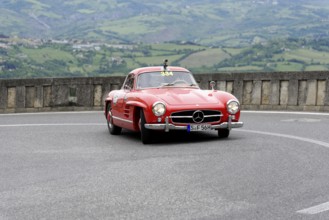 No. 334, Mercedes-Benz 300 SL W 198, model year 1955, Red Mercedes vintage car on a winding road in