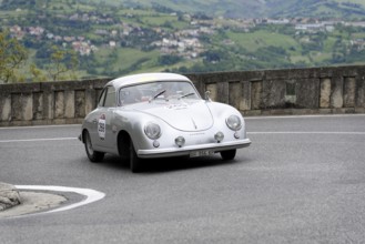 No. 269, Porsche 356 1500, built in 1953, white vintage coupé on a winding road with picturesque