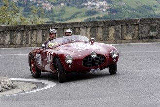 No. 237, Ermini 1100 Sport Motto, built in 1952, red vintage car with helmet-wearing occupants on a