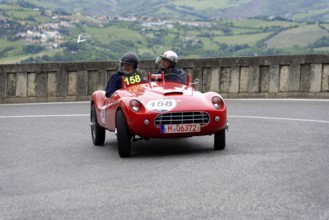 Stanguellini 1100 Sport, built in 1948, red vintage sports car with two occupants on a winding