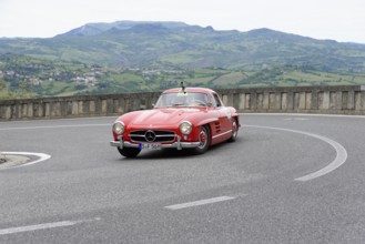 No. 334, Mercedes-Benz 300 SL W 198, model year 1955, Red classic sports car rounding the bend in a