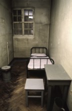 Halle, DEU, 26.01.1999 -- The piece Red Ox: Prison cell (chair/stool, chamber pot, table)