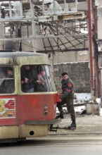BIH, Bosnia, Sarajevo, 09.01.1996, man in uniform rides on tram