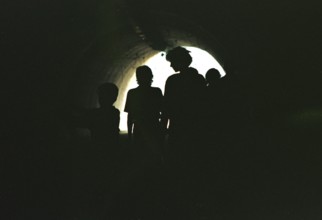 BIH, Sarajevo, 01.09.1995 -- Passers-by walk through an underpass in Sarajevo. During the war