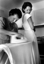 DEU, Westerburg, 09.09.1999 -- Mother of the bride irons the last wrinkles out of the bride's dress