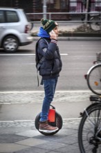 DEU Germany Germany Berlin A teenager makes phone calls with his smartphone while driving an air