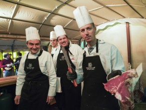 ITA Italy Castelfalfi chefs show the quality of meat during a meeting for tourism managers