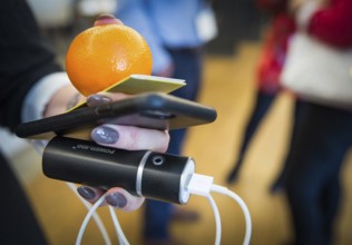 ITA Italy Castelfalfi A participant during a conference for tourism managers with smartphone, power